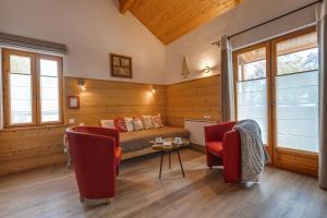 a room with a bed and two chairs and a table at Mountain Lodge in Alps-chez Philippe, Panoramic-Village, Renting, view over Glaciers in La Grave +67 photos