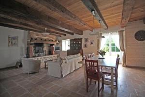 a kitchen and dining room with a table and chairs at Lascaux in Saint-Mathieu