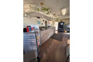 a kitchen and dining room with a counter top at Desert Sands Denton near UNT I 35 TX in Denton