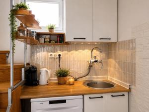 a kitchen counter with a sink and a window at Weekend Joy Home Visoko in Visoko