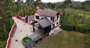 an overhead view of a house with a golf ball at Greenview Homestay in Sakleshpur