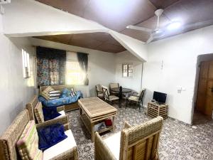 a living room with a couch and a table at Marysa Lodge in Kotu