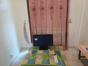a computer monitor sitting on a table in a room at Sunlee Aviana in Bandarawela