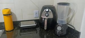 a blender sitting on a counter next to a blender at Bela Vista- LENÇÓIS in Lençóis