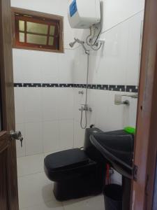 a bathroom with a toilet and a sink at Sunlee Aviana in Bandarawela