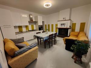 a living room with a couch and a table and a kitchen at Contry House Atessa in Atessa +18 photos