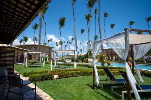a resort with a pool and palm trees at Grand Oca Maragogi All Inclusive Resort in Maragogi +87 photos