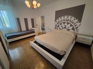 a bedroom with a bed and a bench in it at Contry House Atessa in Atessa