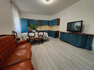a living room with a couch and a table with chairs at Contry House Atessa in Atessa