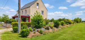 a house with a garden in front of it at ti ar maez in Mauron