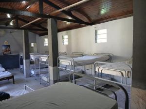 a room with many bunk beds in it at sitio Ibiúna in Ibiúna +13 photos