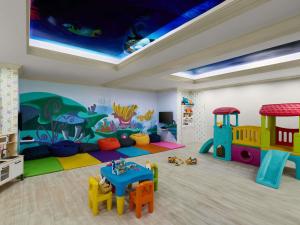 a childrens room with a play area with a play set at Novotel Phuket Resort in Patong Beach