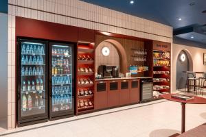 a grocery store with a lot of bottles of alcohol at B&B HOTEL Wrocław Old Town in Wrocław