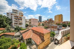 a view of a city with tall buildings at Comfort Boutique Hotel in Tirana