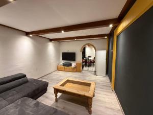 a living room with a couch and a coffee table at Trojaner in Oberort