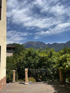 a gate with a view of mountains and trees at Il Brolo in Avenone