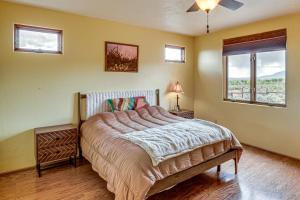a bedroom with a bed and a window at Adobe-Style Taos Home with Great Views! in Taos
