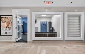 a store front with a display window in a mall at Beachfront Condo with Pool, Balcony & Ocean Views in Fort Lauderdale +52 photos