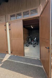 two bikes are parked inside of a garage at L'Atelier No 8 in Saverne +5 photos
