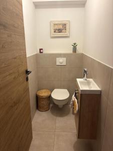 a bathroom with a toilet and a sink at Appartement Bastia Cardo Village in Bastia +12 photos