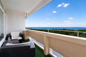 a balcony with a view of the ocean at Panoramic App A06-6 in Sierksdorf