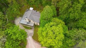 an overhead view of a house in the middle of a forest at Moonbeam Chalet in Logan