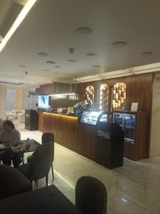 a lobby of a restaurant with a counter and a bar at Boutique Hotel El Mesaadia in Cairo