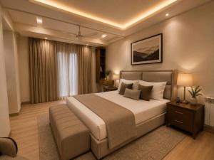 a bedroom with a large bed in a room at LMY Boutique Prestige Hotel Apartments - Murree Monal Expressway in Murree