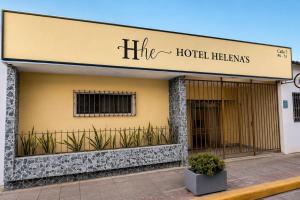 a building with a sign that reads the hotel hezbollah at Ayenda Hotel Helenas in Ríohacha