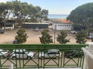 a balcony with a view of a parking lot at Erjani Hotel in Velipojë