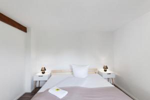 a bedroom with a bed with two night stands at Naturparadies an der Saale in Könnern
