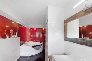 a bathroom with a white sink and a mirror at Naturparadies an der Saale in Könnern +17 photos