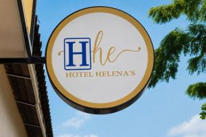 a sign for a hotel heinemann at Ayenda Hotel Helenas in Ríohacha