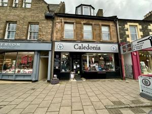 a group of shops on a city street at Stay 55 in Peebles