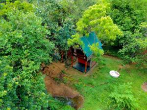 an overhead view of a tree house in the woods at Mango Tree Villa in Sigiriya