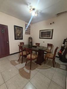 a dining room with a table and chairs at ISIS HOTEl in Tumbes