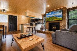 a living room with a couch and a fireplace at Mountain Views at Dolly's Castle Unit 3 in Sevierville