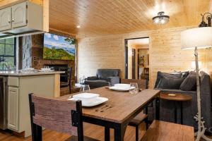 a kitchen and dining room with a table in a cabin at Mountain Views at Dolly's Castle Unit 3 in Sevierville