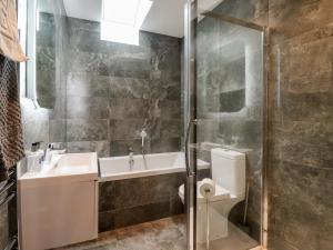 a bathroom with a toilet and a sink and a shower at Miller's Wheel in Harrogate +20 photos