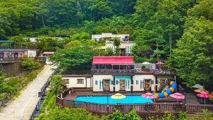 an aerial view of a house with a swimming pool at Ulsan Lime House in Ulsan