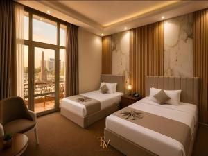 Postel nebo postele na pokoji v ubytování Tahrir Crown View Hotel - Downtown