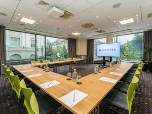 a conference room with a long table and chairs at Novotel Vilnius Centre in Vilnius