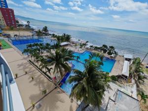 an overhead view of a resort with a pool and the ocean at fontaine bleau piso 4F in Atacames