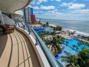 a balcony with a view of the beach and the ocean at fontaine bleau piso 4F in Atacames