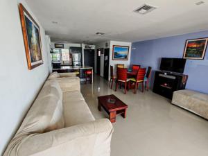 a living room with a couch and a table at fontaine bleau piso 4F in Atacames