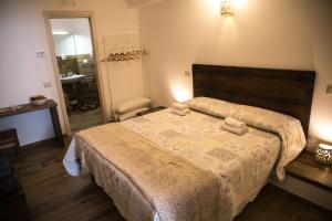 A bed or beds in a room at Casa Rosselli
