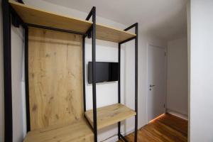 a room with a tv on top of a shelf at Medusa Historic Luxury Hotel Galata in Istanbul +24 photos