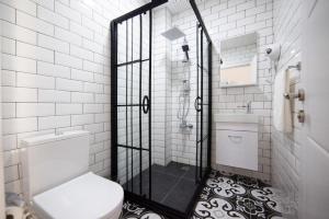 a bathroom with a shower with a toilet and a sink at Medusa Historic Luxury Hotel Galata in Istanbul