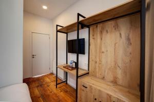 a bedroom with a bed and a wooden wall at Medusa Historic Luxury Hotel Galata in Istanbul