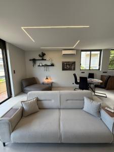 a living room with a couch and a table at Notos Suites in Athens